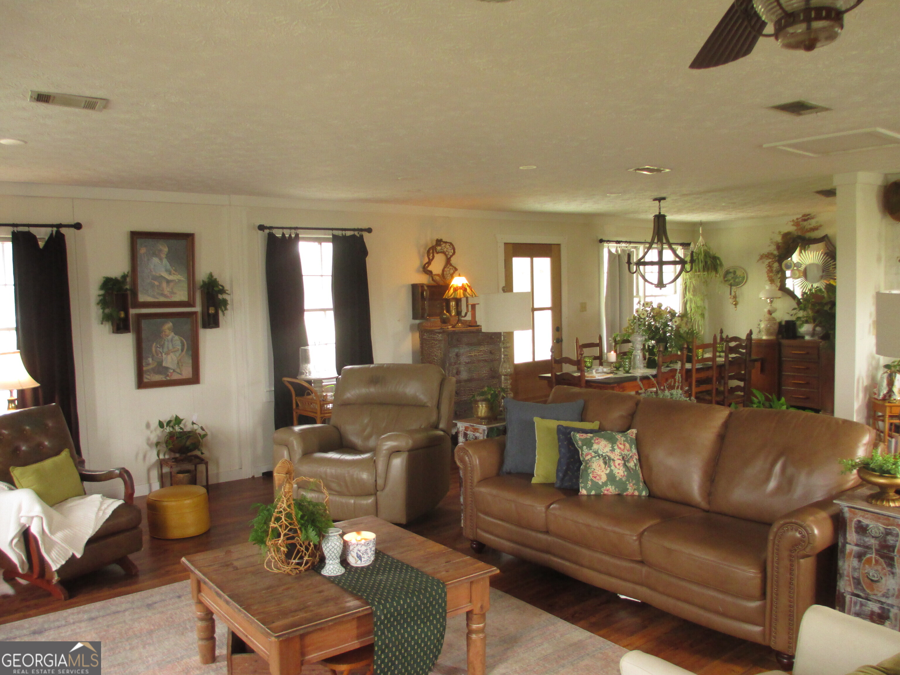 84 Comer Yawn Road Hazlehurst, GA 31539 - Photo 13 of 24 a living room with furniture and a flat screen tv