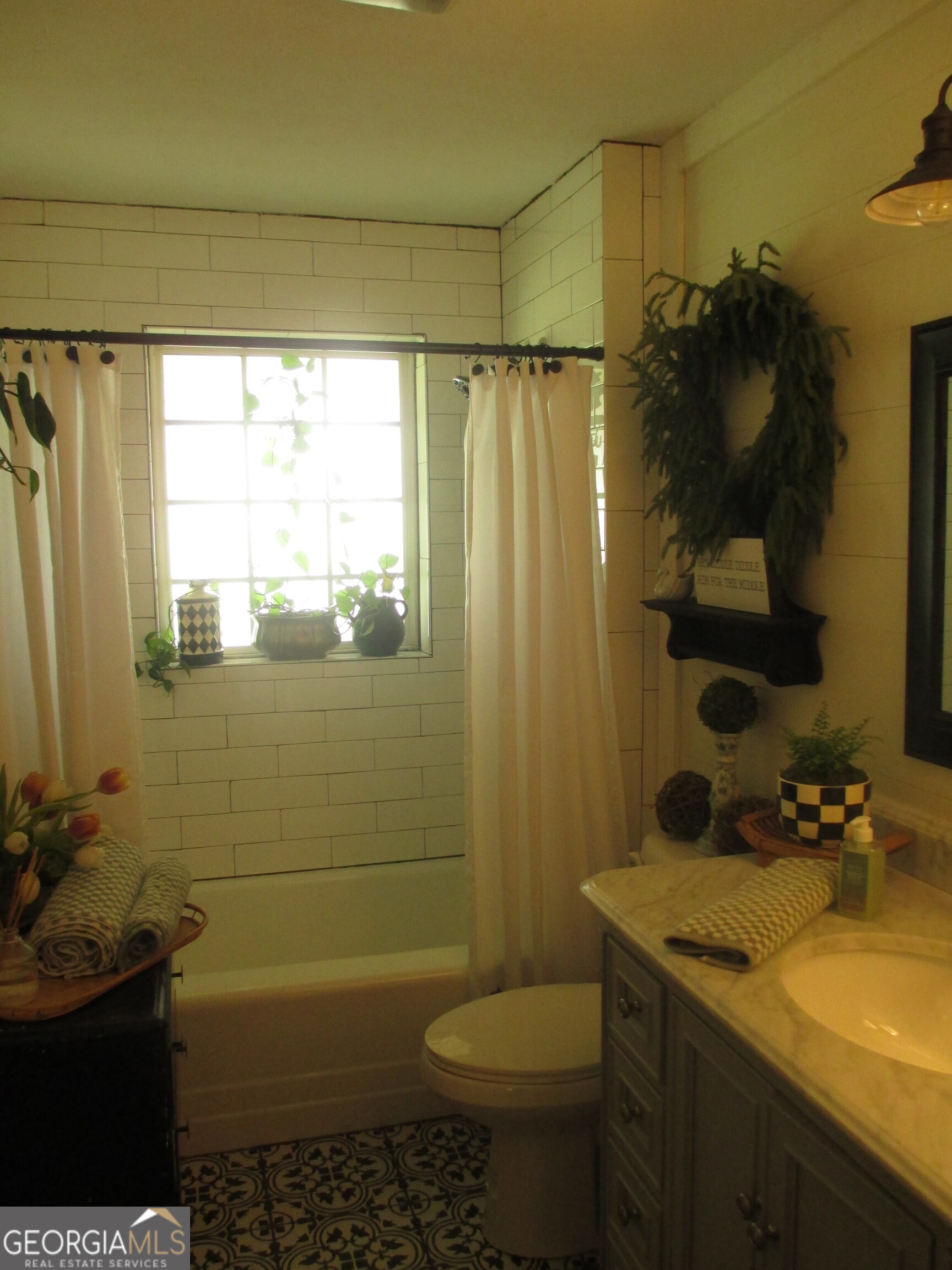 84 Comer Yawn Road Hazlehurst, GA 31539 - Photo 17 of 24 a bathroom with a sink toilet and shower