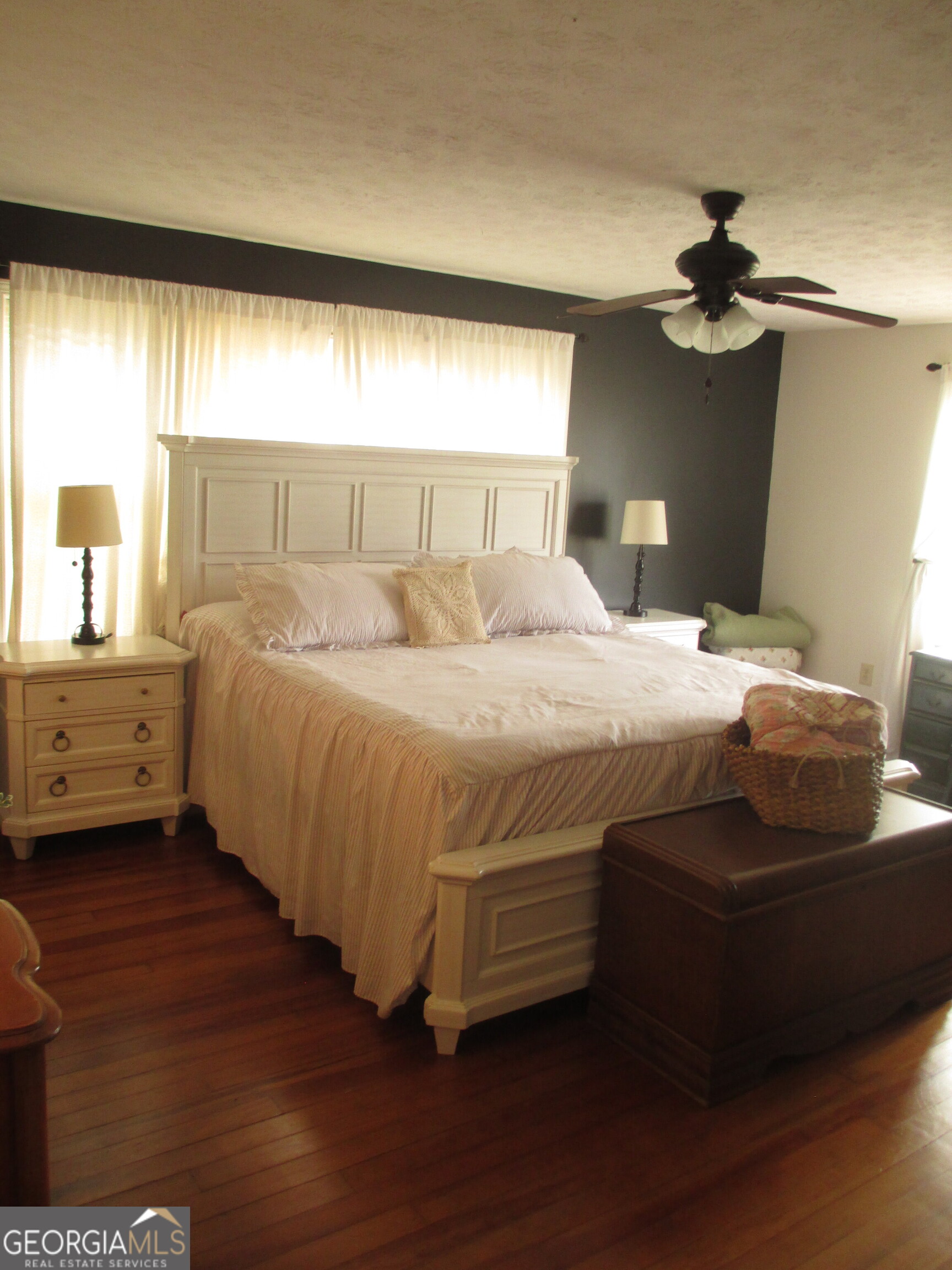 84 Comer Yawn Road Hazlehurst, GA 31539 - Photo 19 of 24 a bedroom with a bed and a night stand