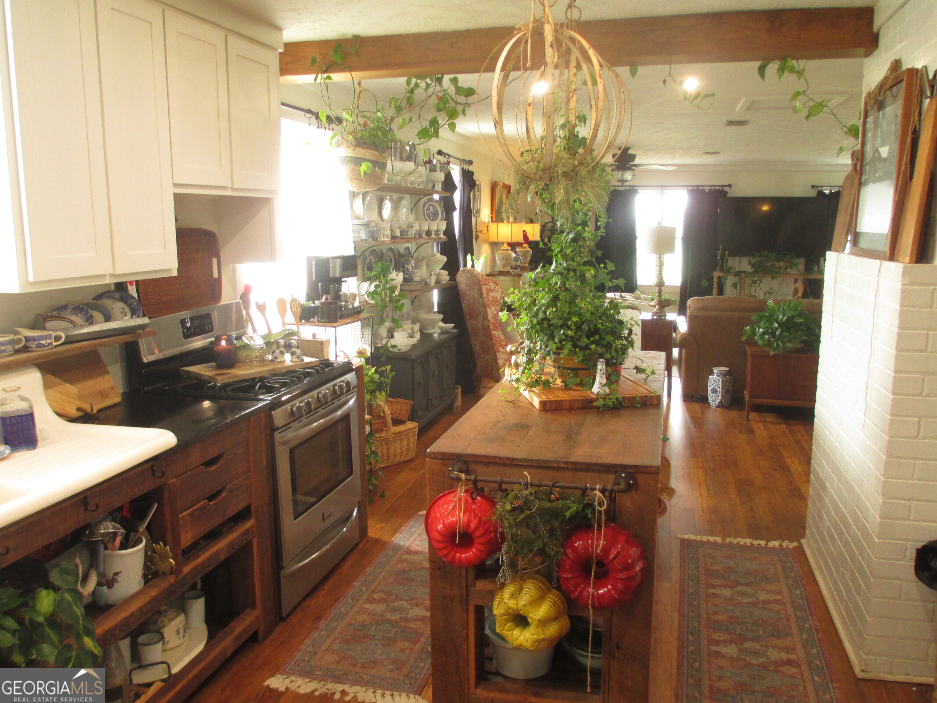 84 Comer Yawn Road Hazlehurst, GA 31539 - Photo 24 of 24 a kitchen with stainless steel appliances granite countertop a stove and cabinets
