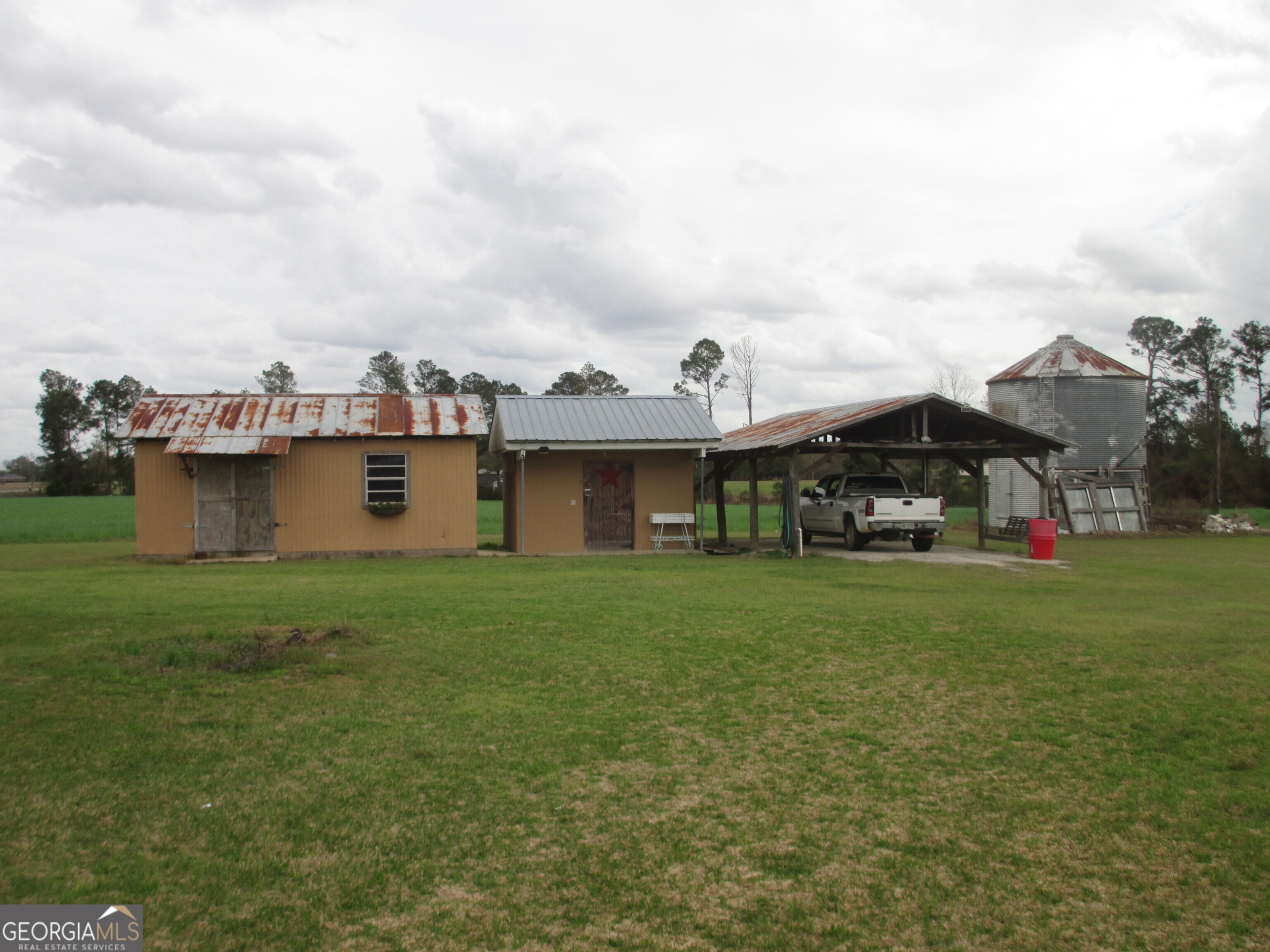 84 Comer Yawn Road Hazlehurst, GA 31539 - Photo 6 of 24 a view of a house with a back yard