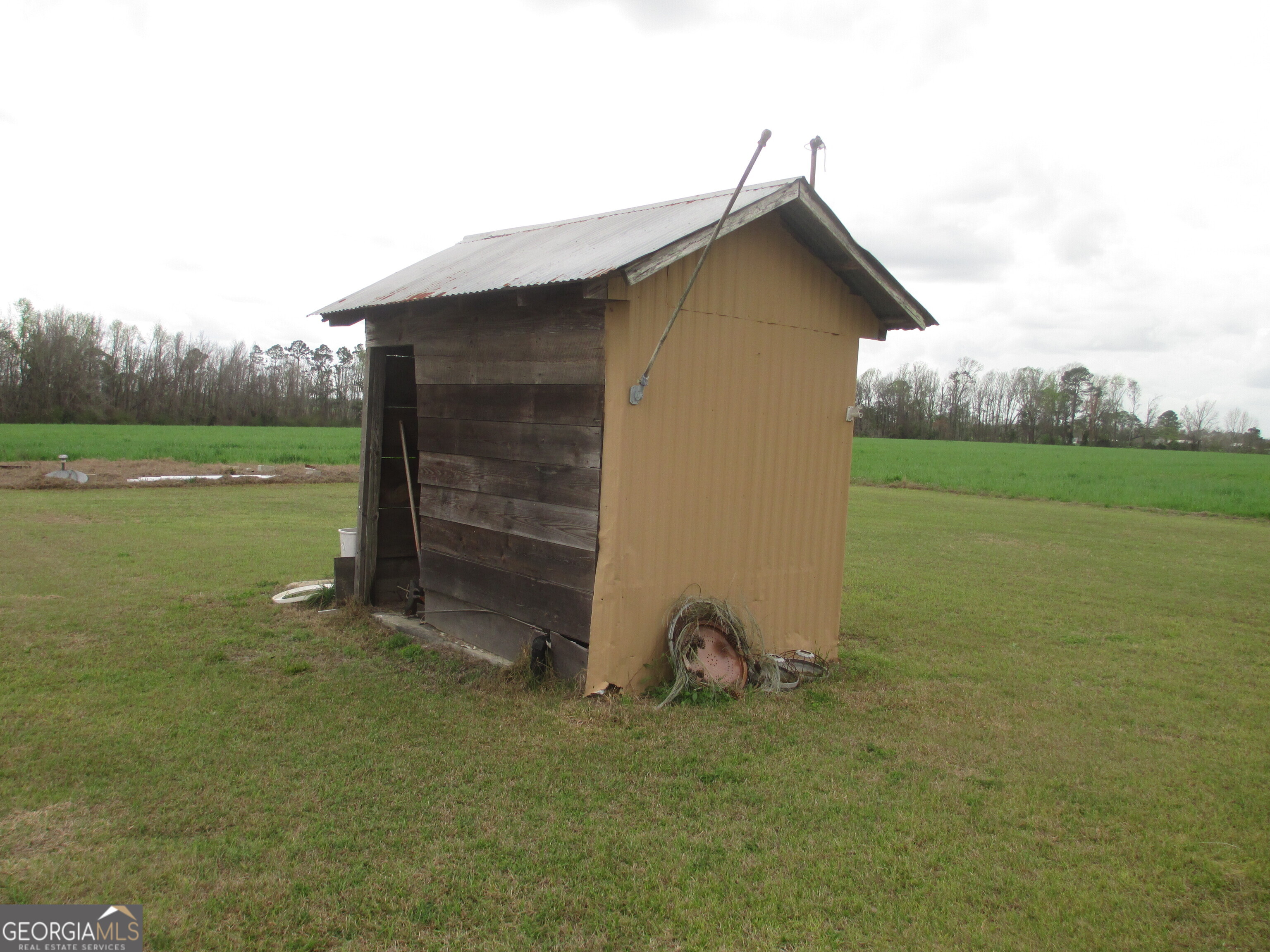 84 Comer Yawn Road Hazlehurst, GA 31539 - Photo 7 of 24 a view of a house with backyard
