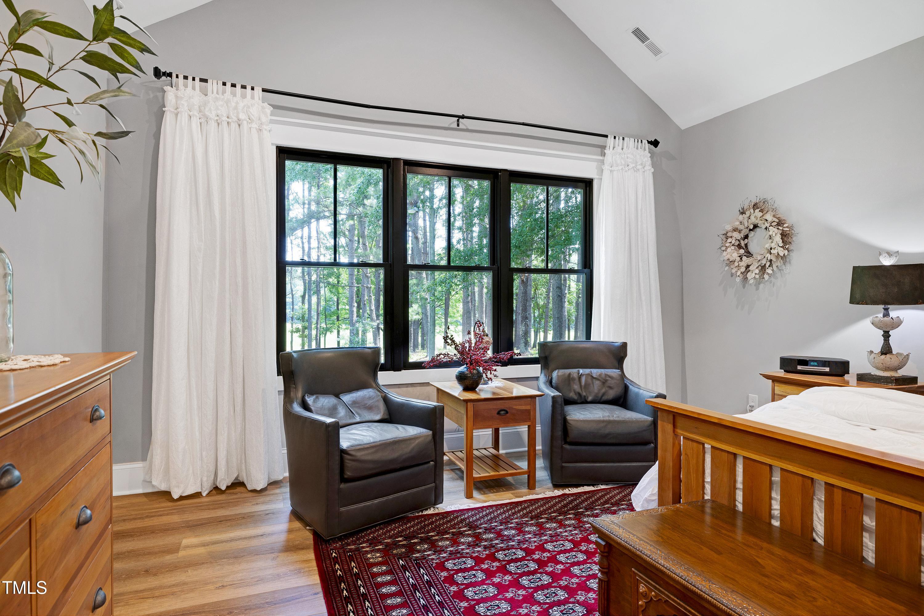 5859 Vicksboro Road Henderson, NC 27537 - Photo 30 of 65 a bedroom with furniture and a window