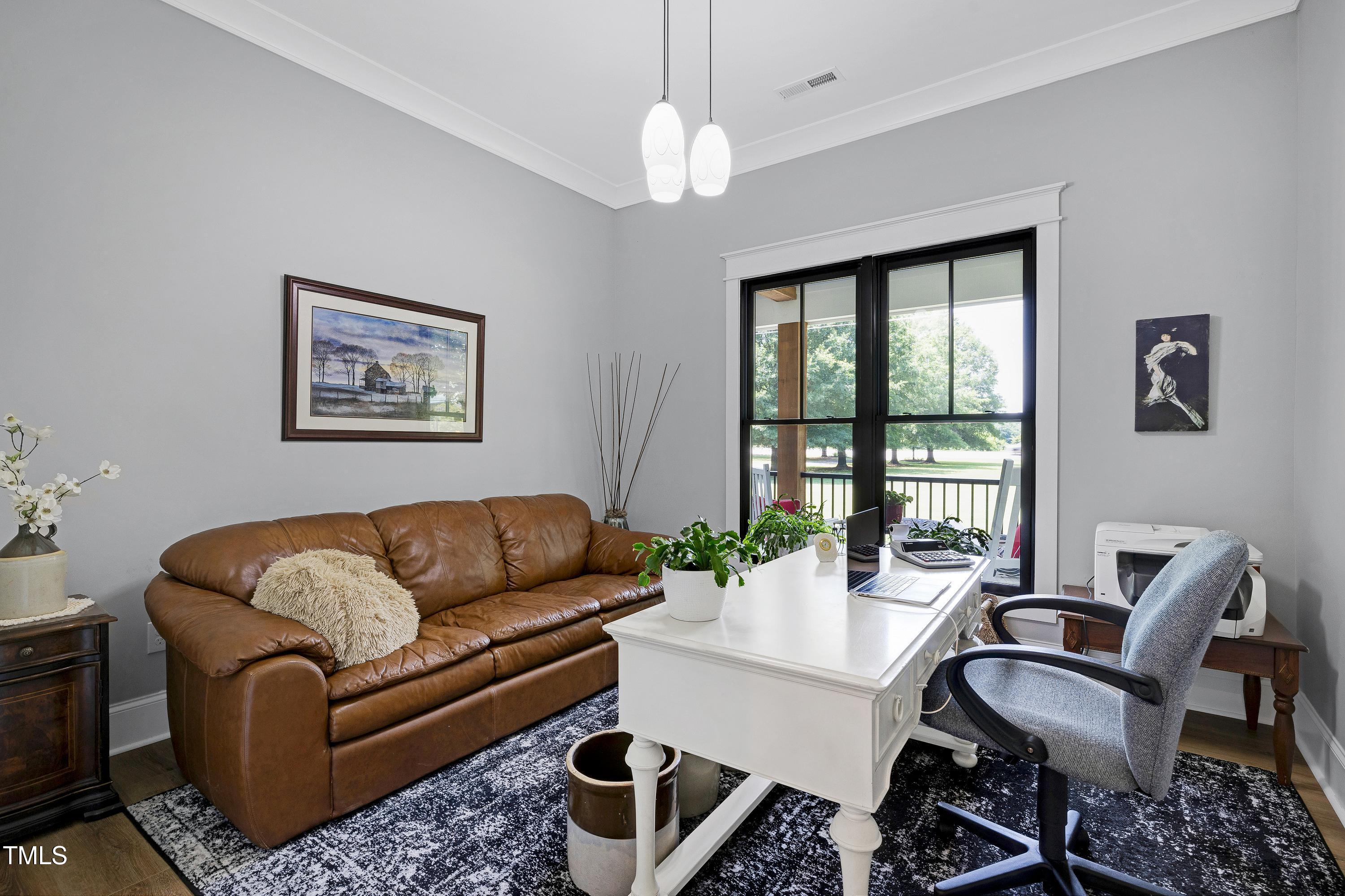 5859 Vicksboro Road Henderson, NC 27537 - Photo 39 of 65 a living room with furniture and a large window