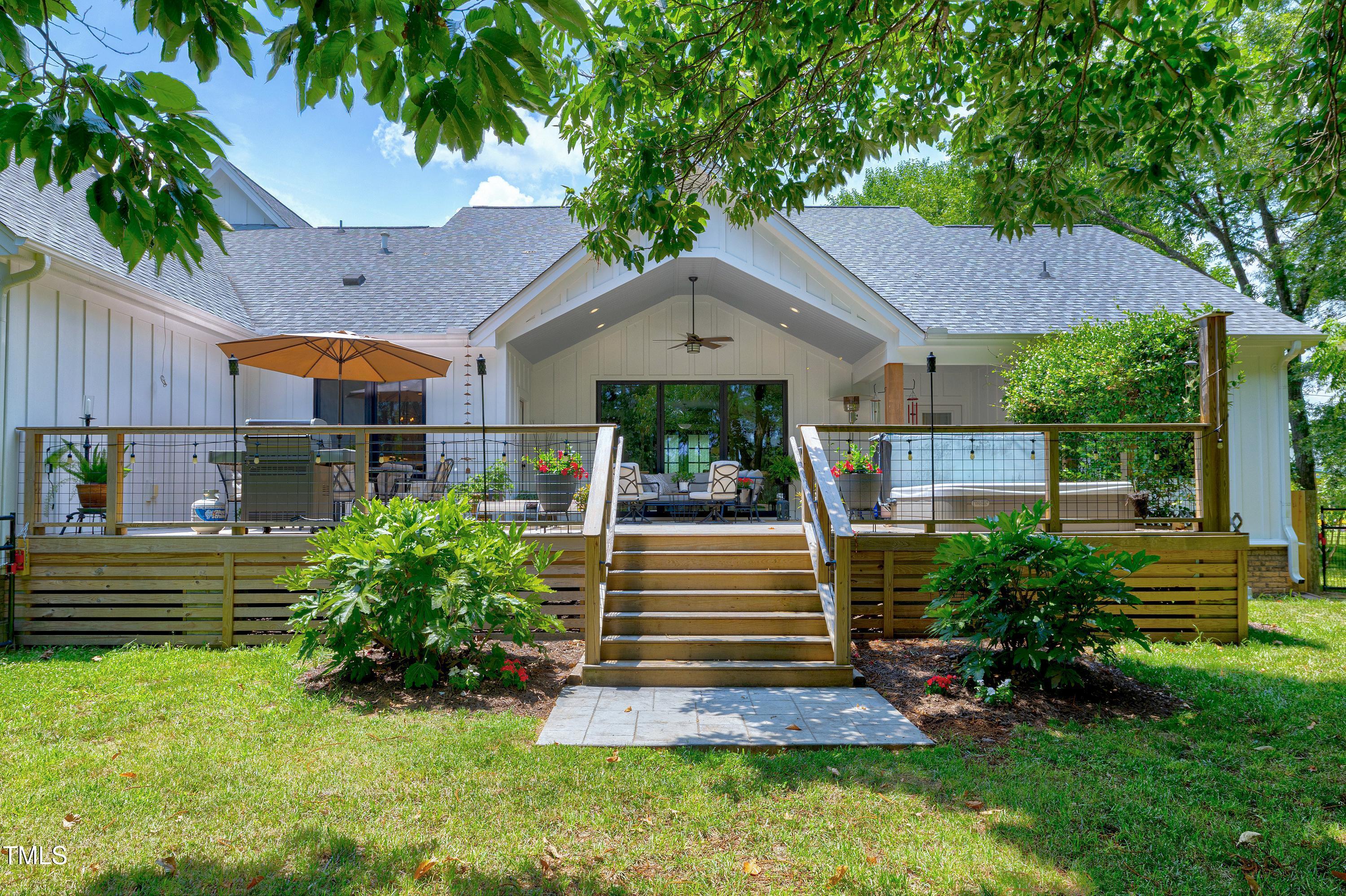 5859 Vicksboro Road Henderson, NC 27537 - Photo 54 of 65 a front view of a house with a yard