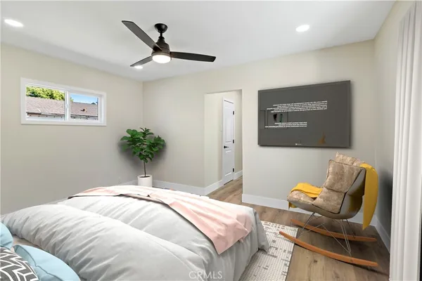 a bedroom with a bed and chair