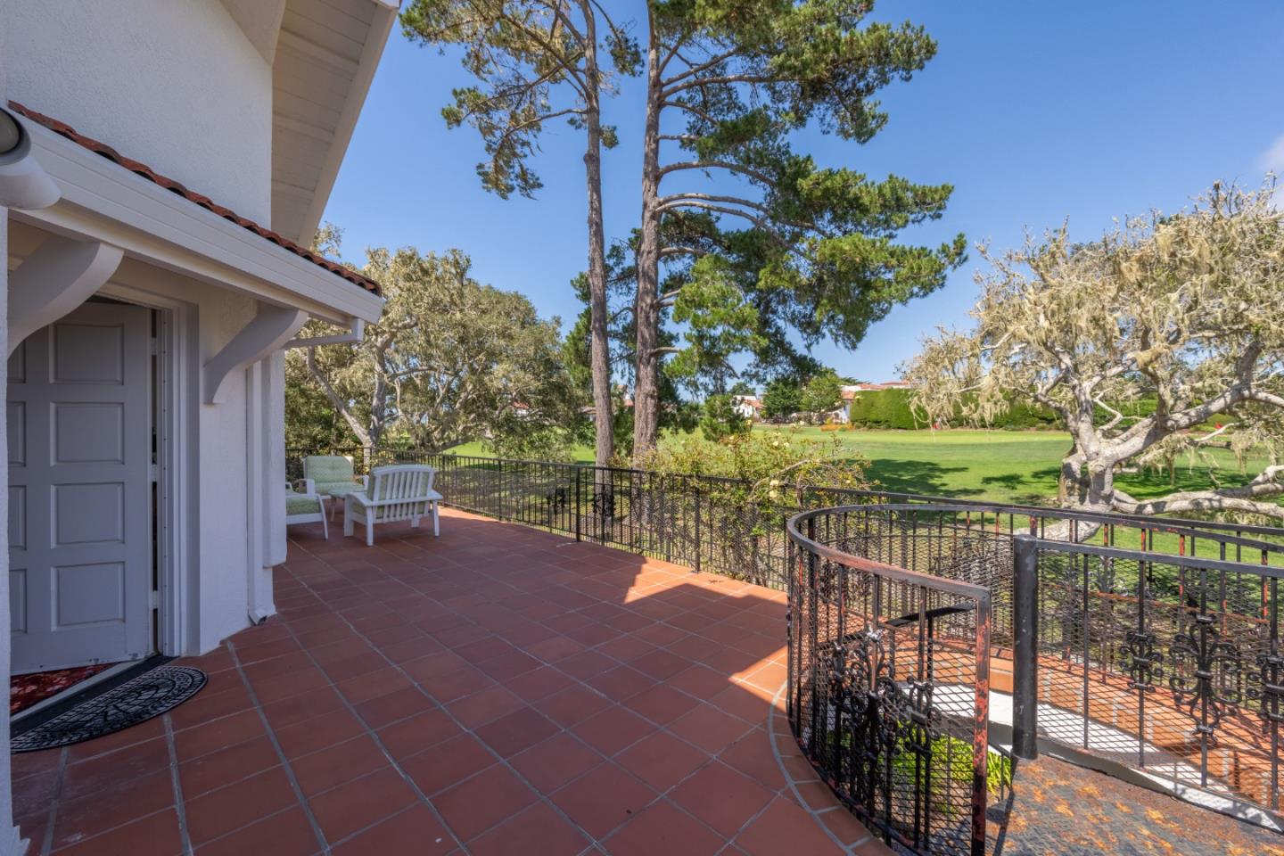 1043 Broncho Road Pebble Beach, CA 93953 - Photo 13 of 21 a view of a patio with couches table and chairs and potted plants