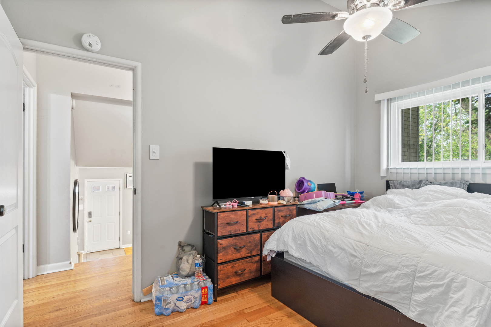 400 North Addison Road Villa Park, IL 60181 - Photo 14 of 21 a bedroom with a bed and a flat screen tv