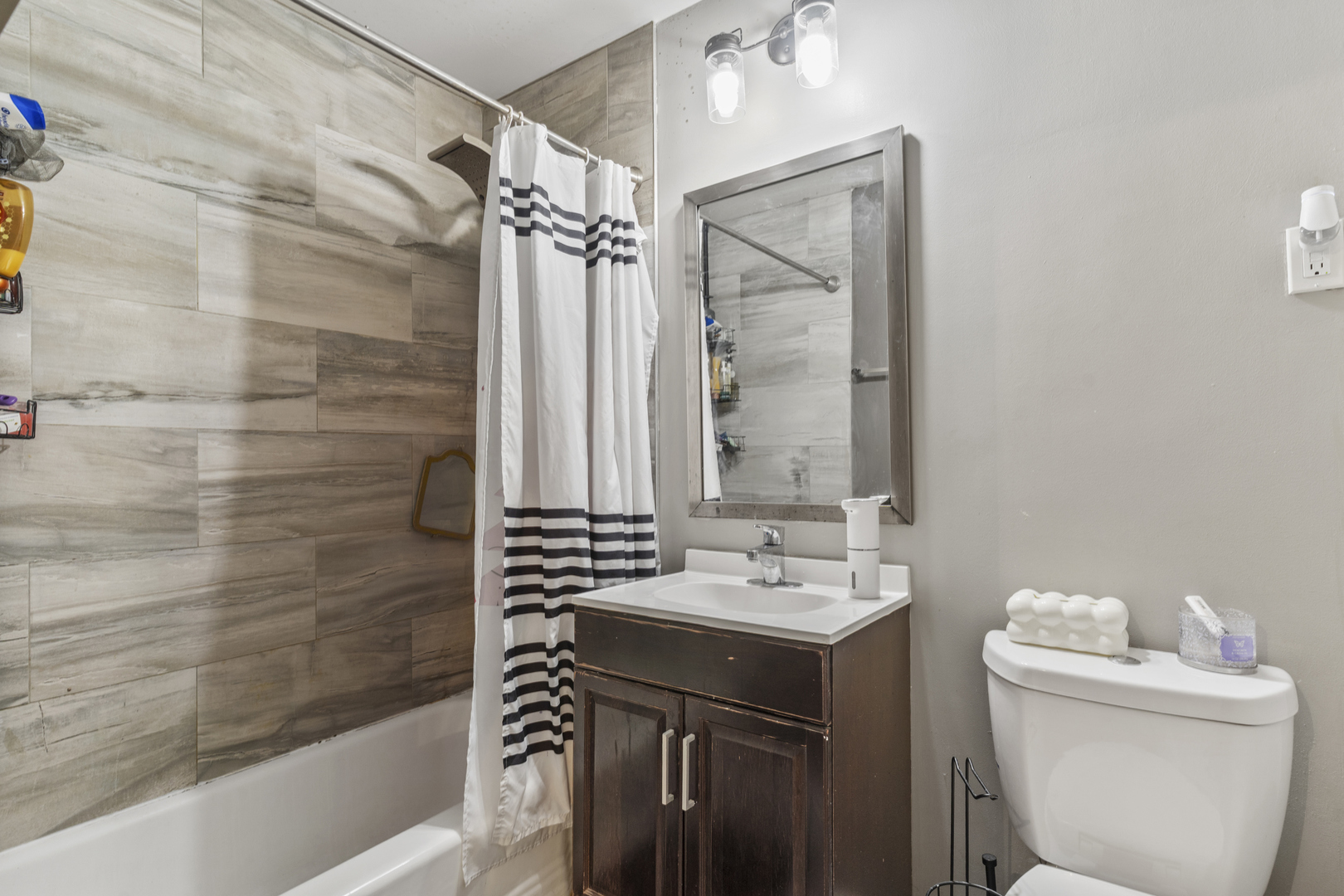 400 North Addison Road Villa Park, IL 60181 - Photo 15 of 21 a bathroom with a sink a toilet and shower