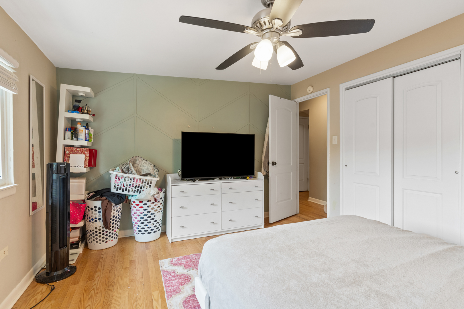 400 North Addison Road Villa Park, IL 60181 - Photo 10 of 21 a bedroom with a bed and a flat screen tv