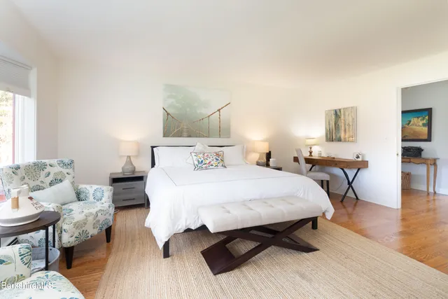 a bed room with a bed and a table