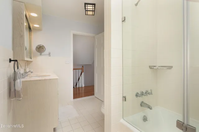 a bathroom with a bathtub and a sink