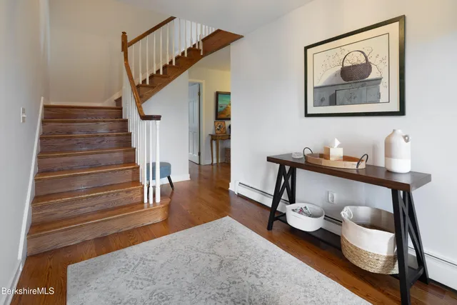 a workspace with wooden floor and furniture