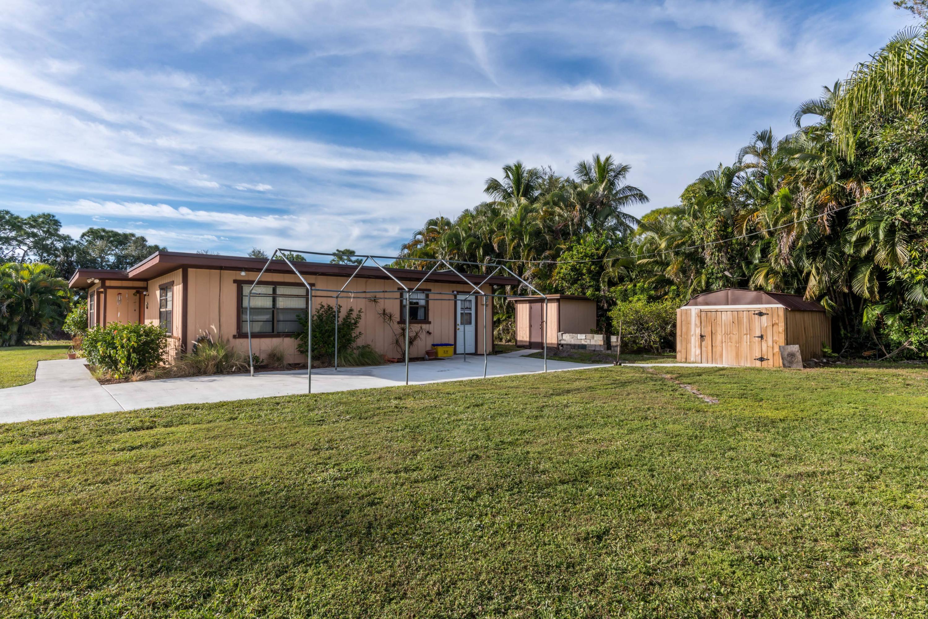 156 Akron Road Lake Worth, FL 33467 - Photo 2 of 22 1 Side Yard