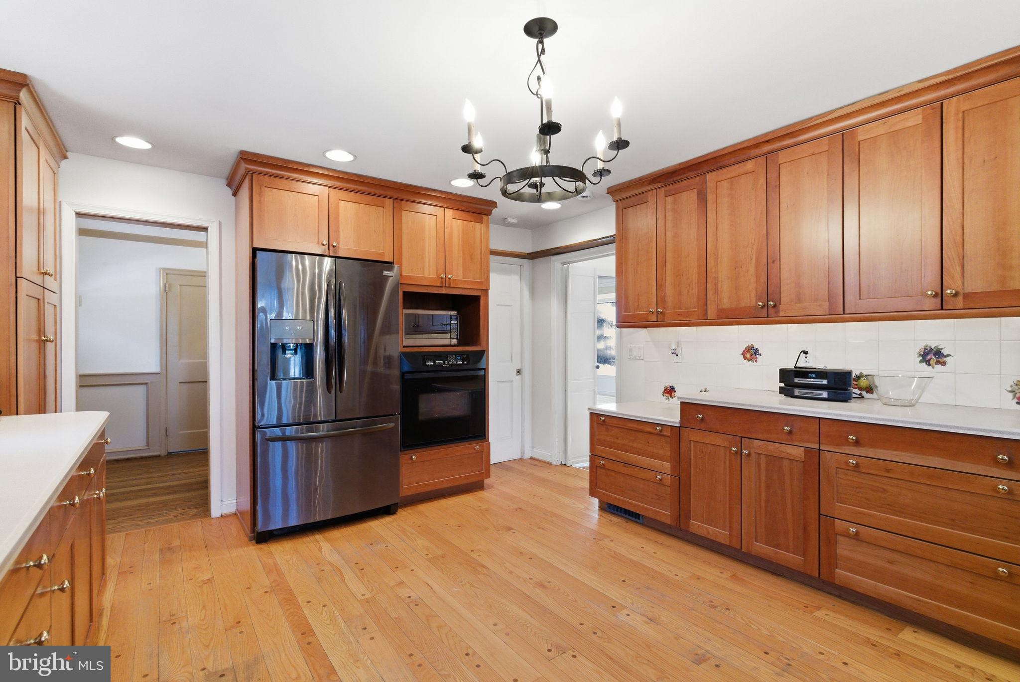416 Rices Mill Road Wyncote, PA 19095 - Photo 12 of 60 a kitchen with stainless steel appliances granite countertop a refrigerator a sink and a stove