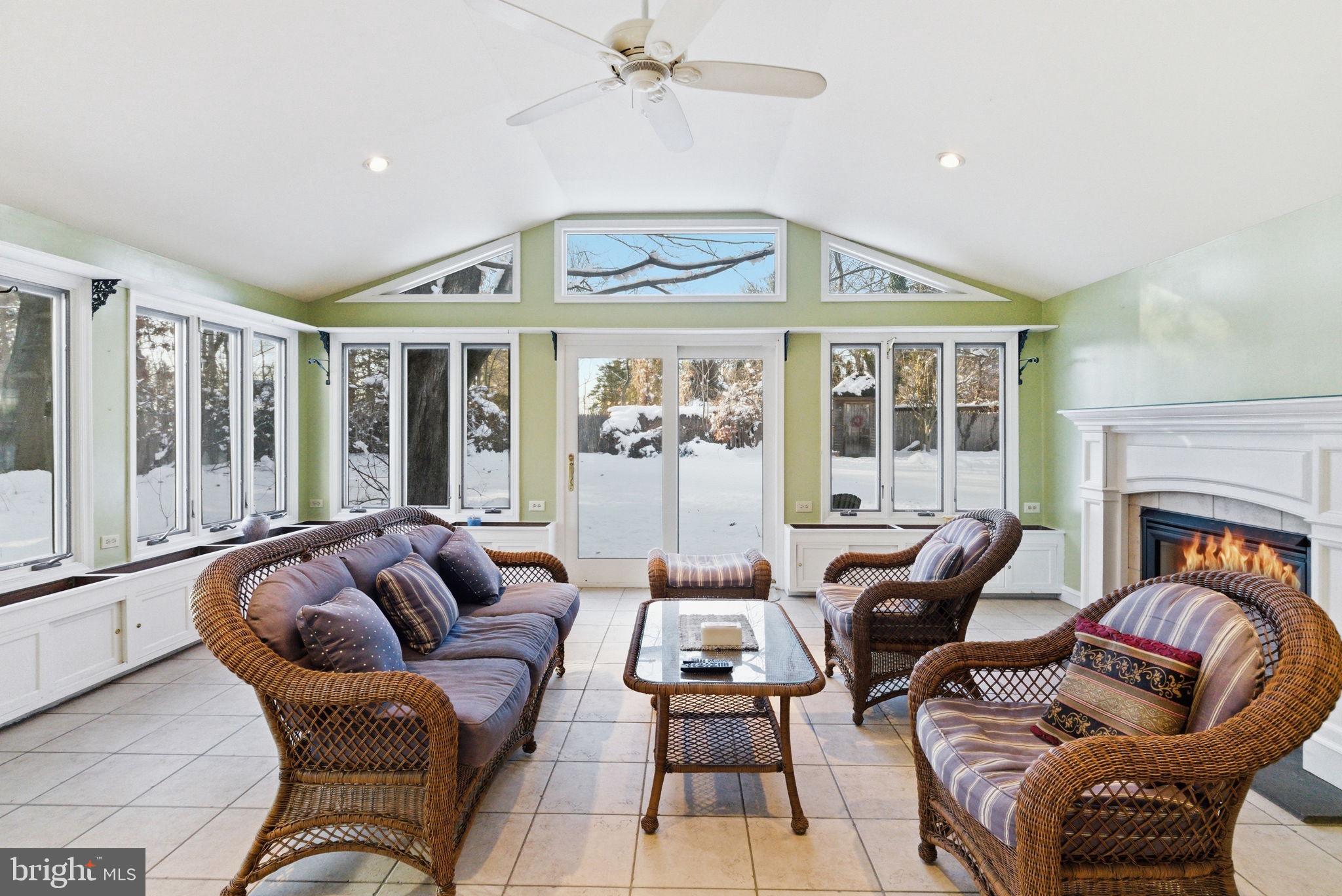 416 Rices Mill Road Wyncote, PA 19095 - Photo 19 of 60 a living room with furniture a fireplace and a chandelier