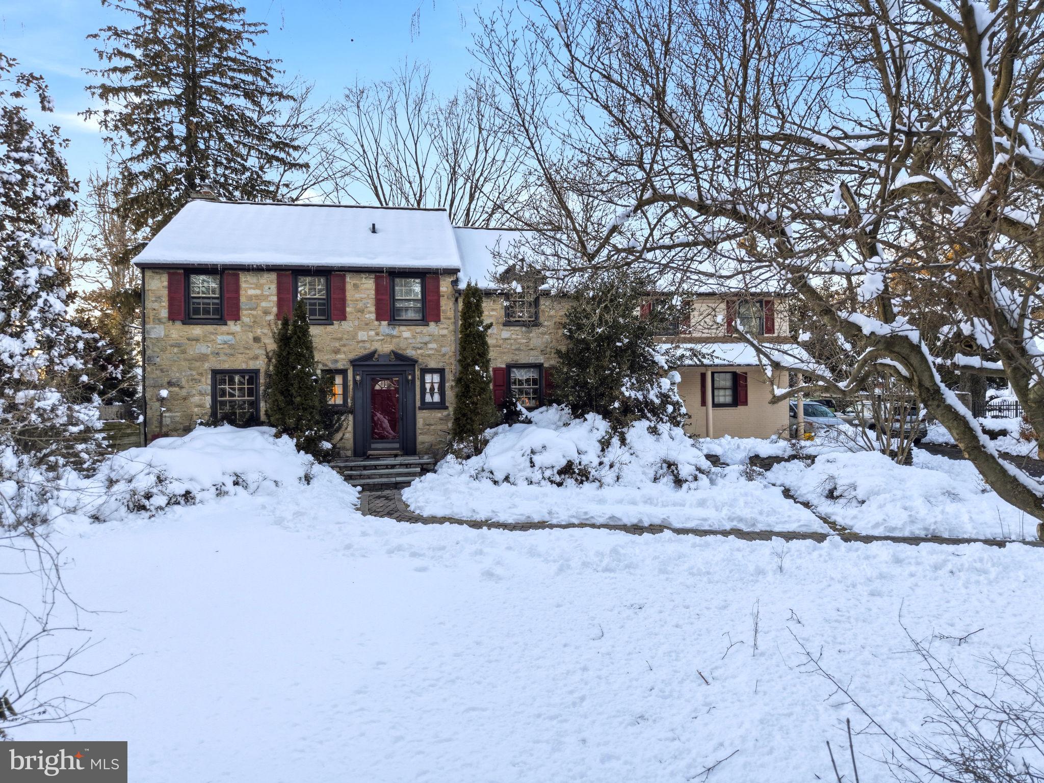 416 Rices Mill Road Wyncote, PA 19095 - Photo 2 of 60 a front view of a house with a yard covered in snow