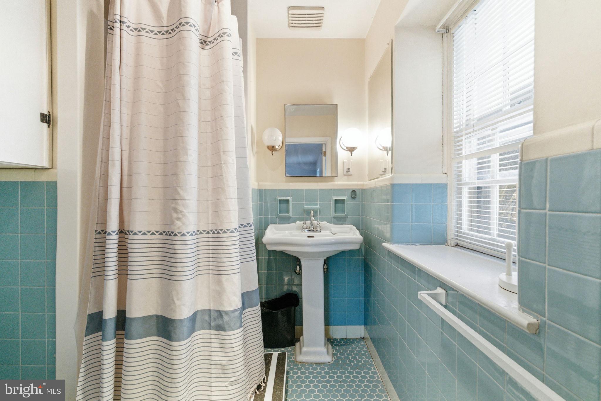 416 Rices Mill Road Wyncote, PA 19095 - Photo 36 of 60 a bathroom with a sink a mirror and shower