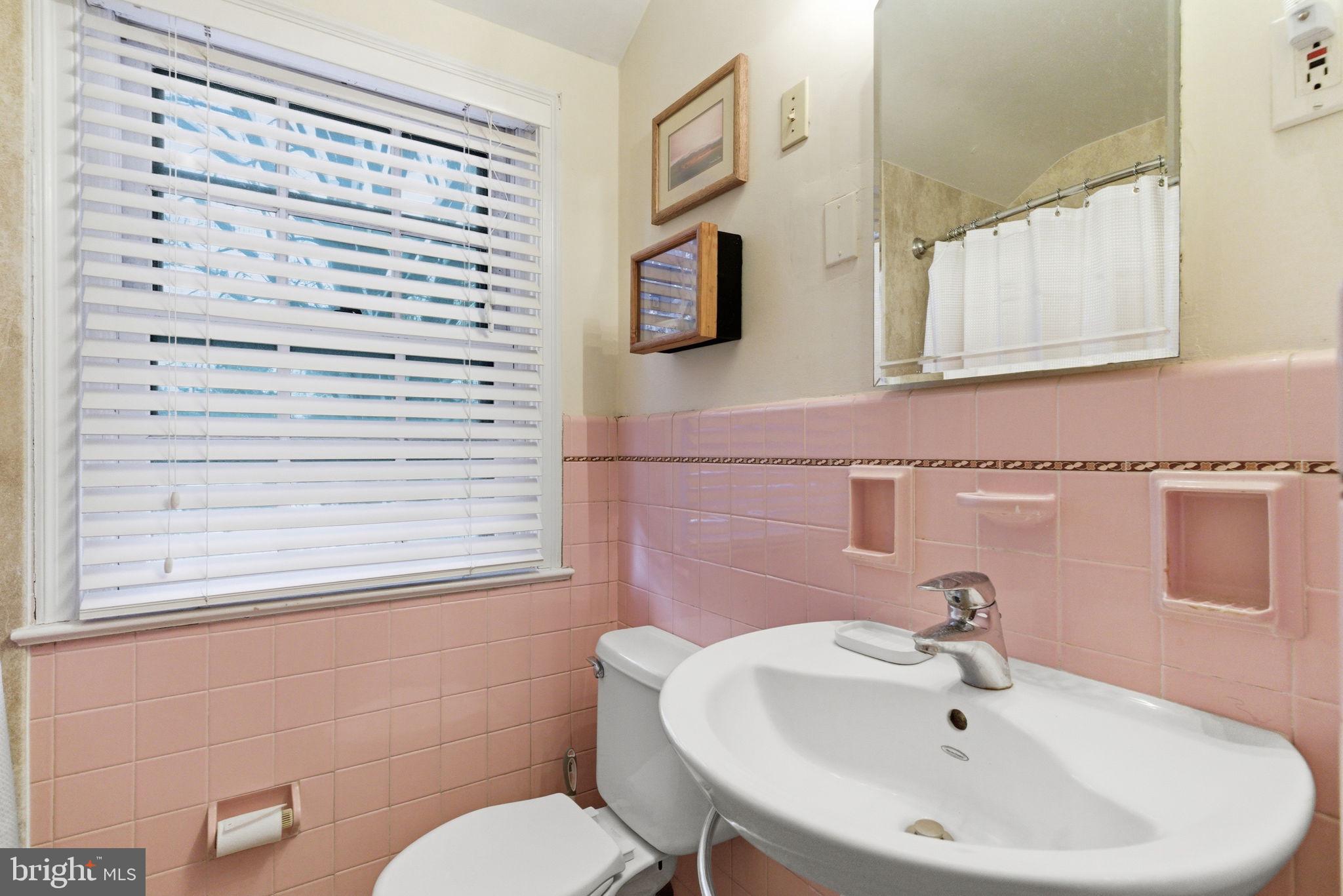416 Rices Mill Road Wyncote, PA 19095 - Photo 41 of 60 a bathroom with a sink a mirror and a toilet