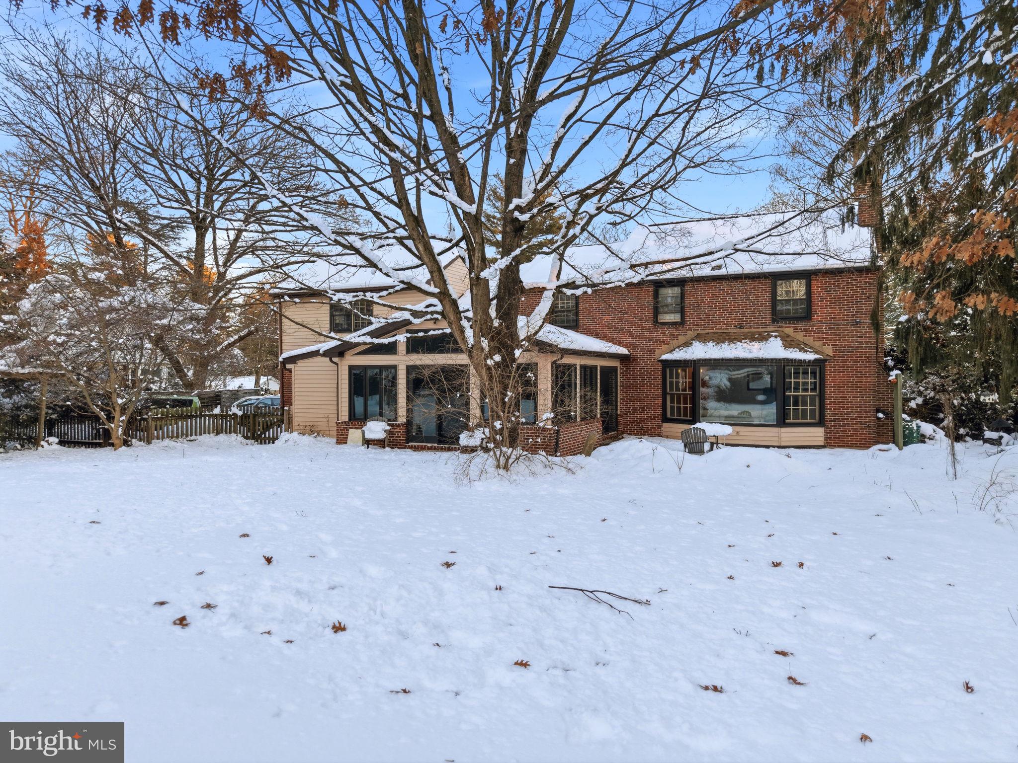 416 Rices Mill Road Wyncote, PA 19095 - Photo 47 of 60 a front view of a house with a yard covered with snow in front of house