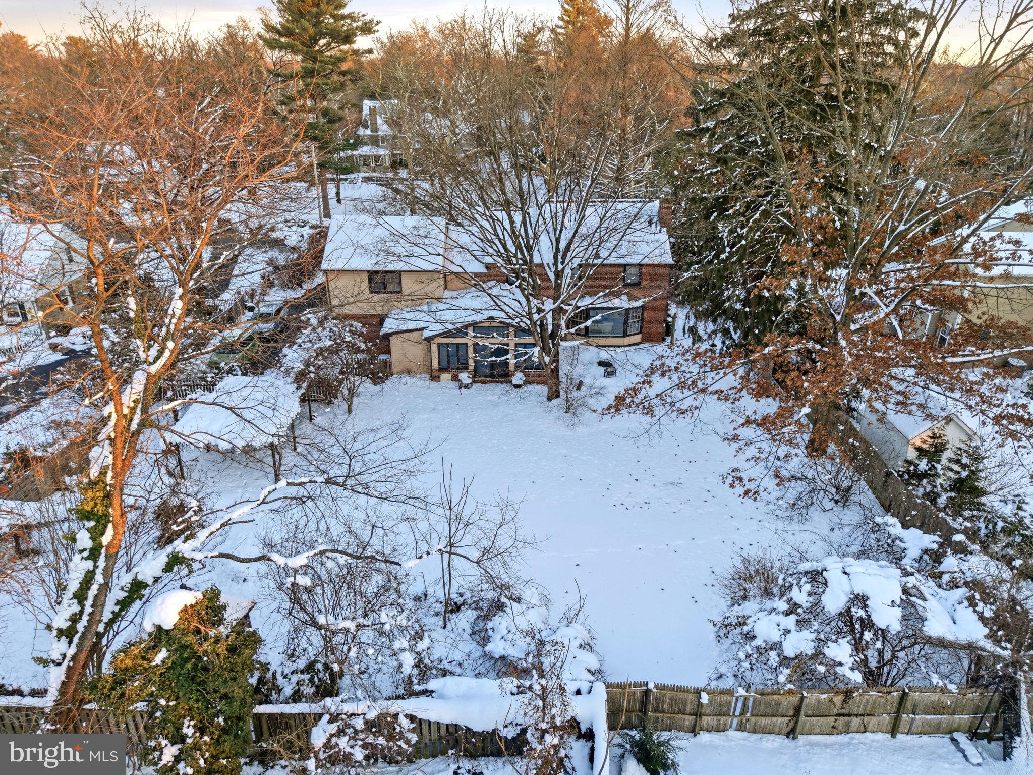416 Rices Mill Road Wyncote, PA 19095 - Photo 48 of 60 a view of a house with a yard covered in snow