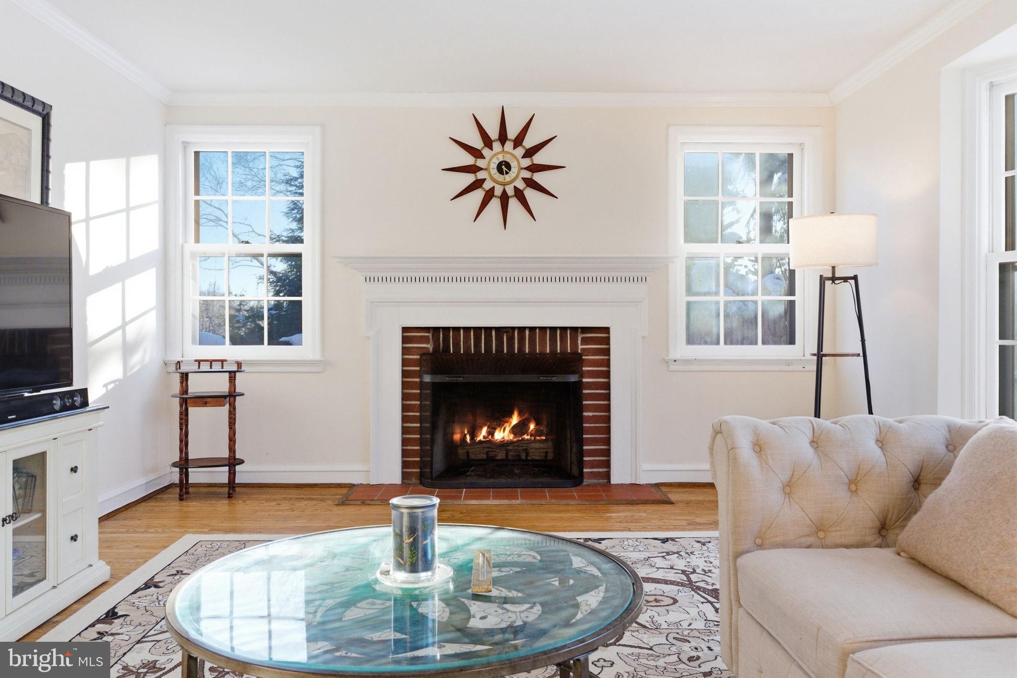 416 Rices Mill Road Wyncote, PA 19095 - Photo 7 of 60 a living room with furniture a fireplace and a flat screen tv