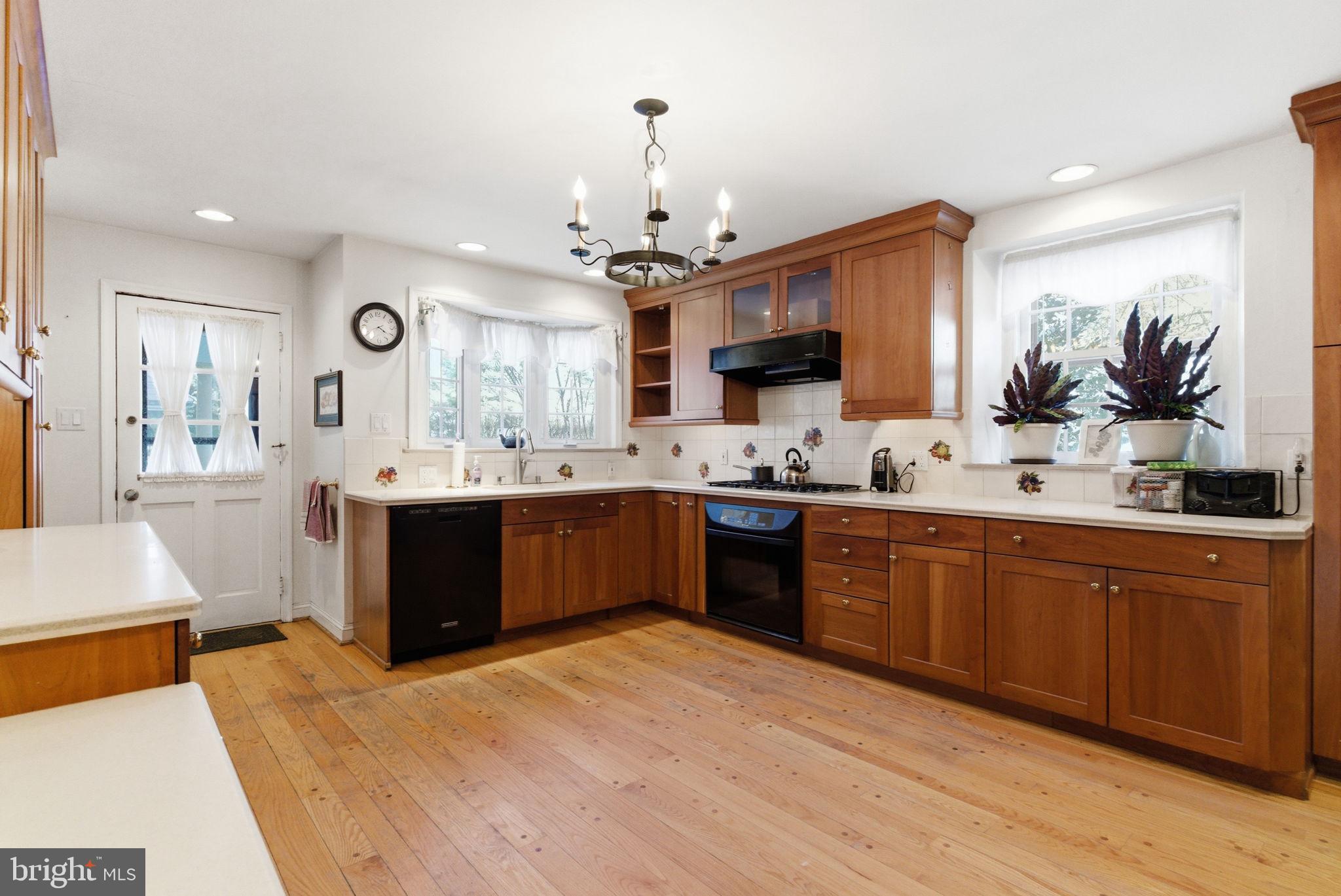 416 Rices Mill Road Wyncote, PA 19095 - Photo 10 of 60 a large kitchen with kitchen island a sink stainless steel appliances and cabinets