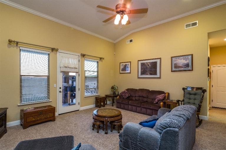 21088 Del Monte Road Madera, CA 93638 - Photo 8 of 10 a living room with furniture and a window