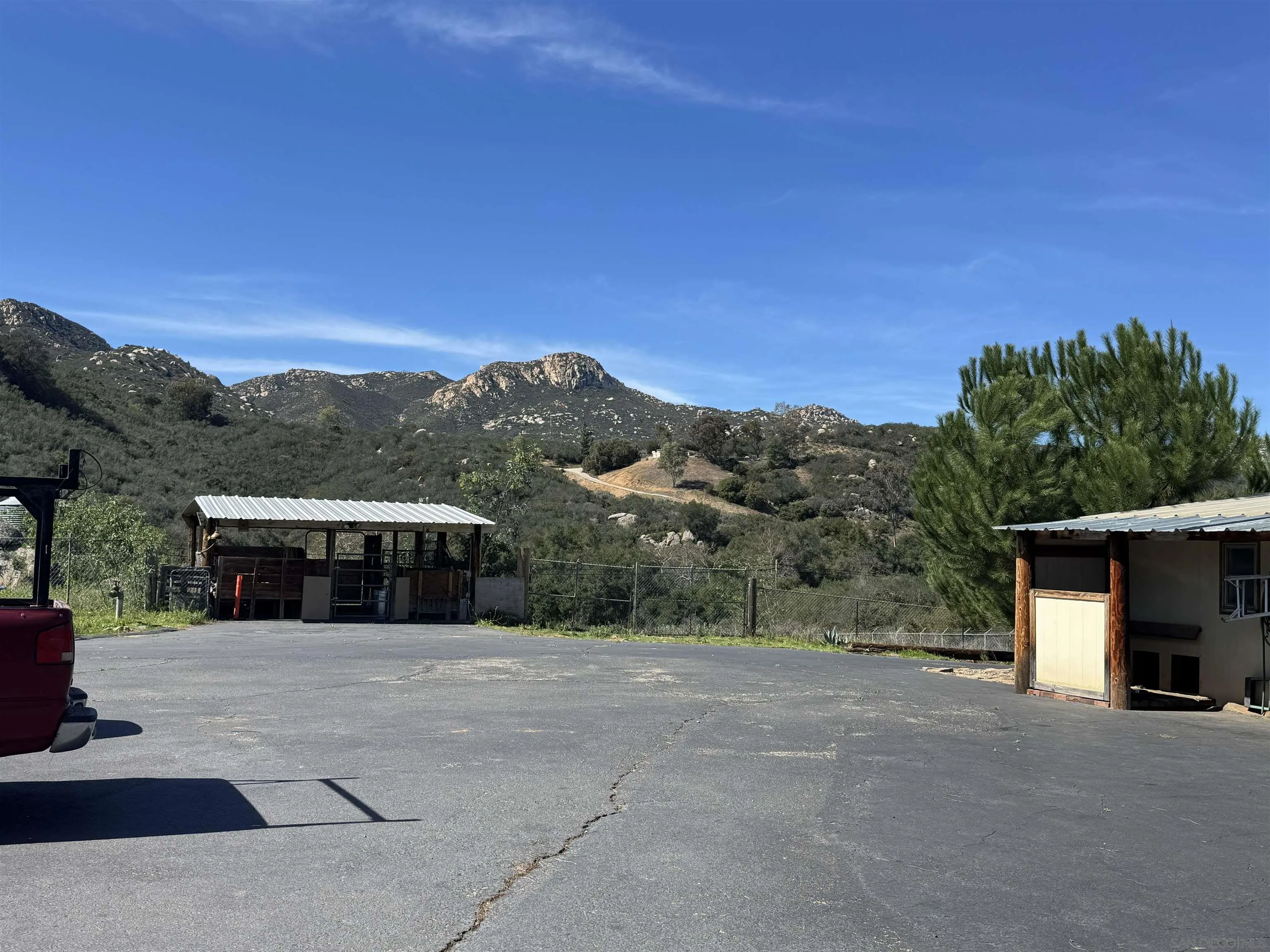 14959 Mussey Grade Road Ramona, CA 92065 - Photo 22 of 28 Adjacent to the home is a large open space, chicken coup, animal pen and horse riding staging area.