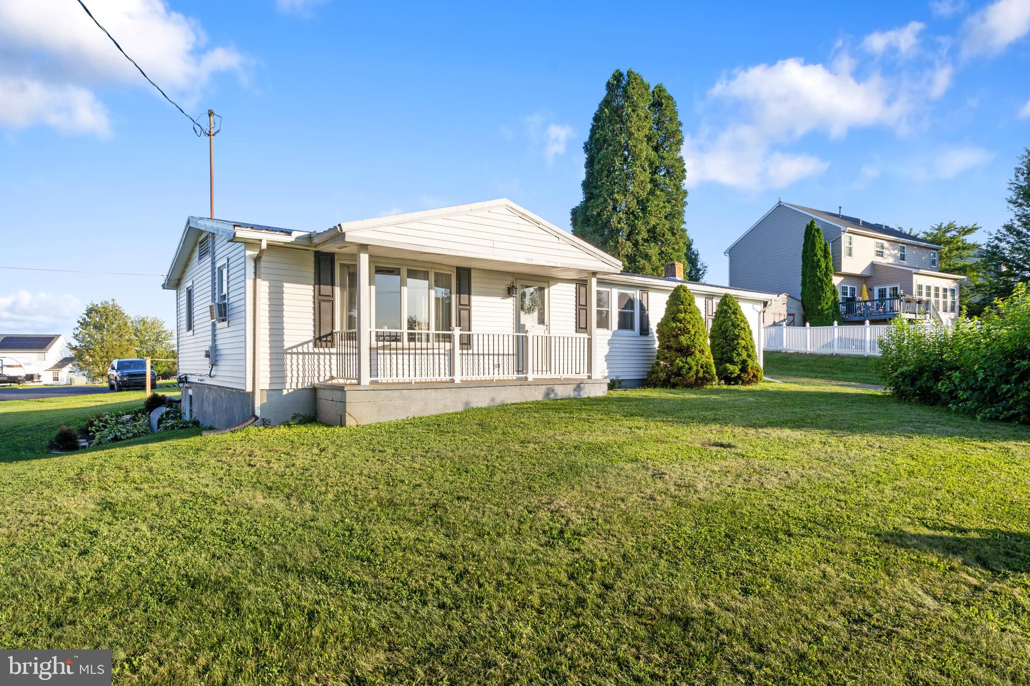 397 Sechrist Flat Road Felton, PA 17322 - Photo 1 of 44 a front view of a house with garden