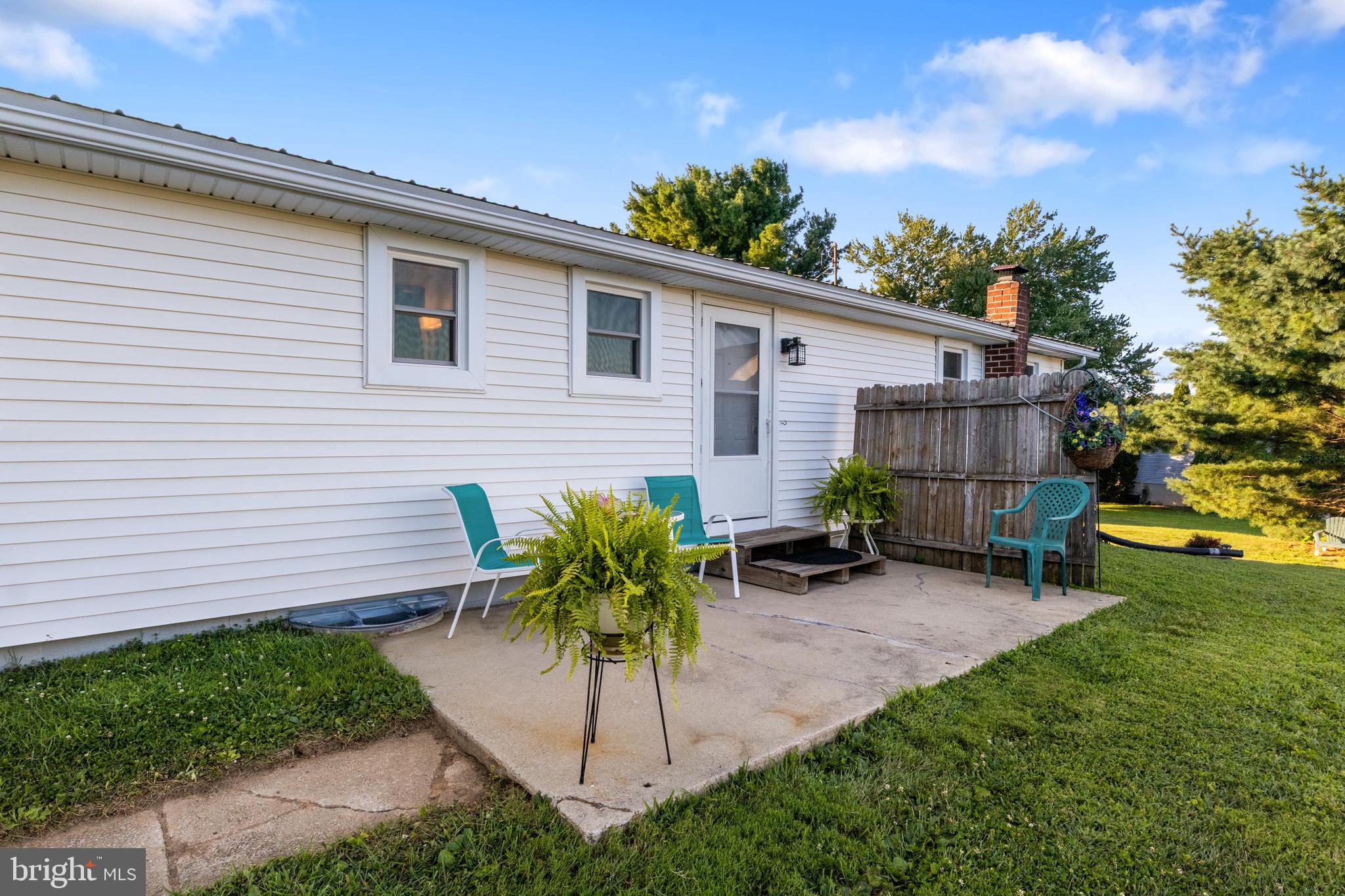 397 Sechrist Flat Road Felton, PA 17322 - Photo 30 of 44 a view of a backyard with a sitting area and a small barn