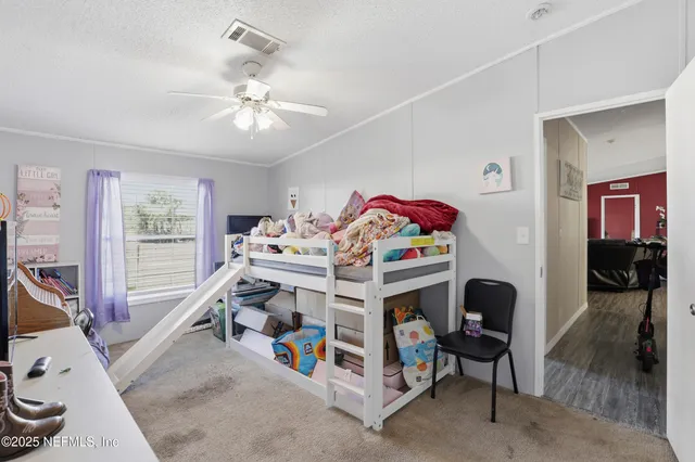 a view of a balcony with lake view and a floor to ceiling window next to a yard