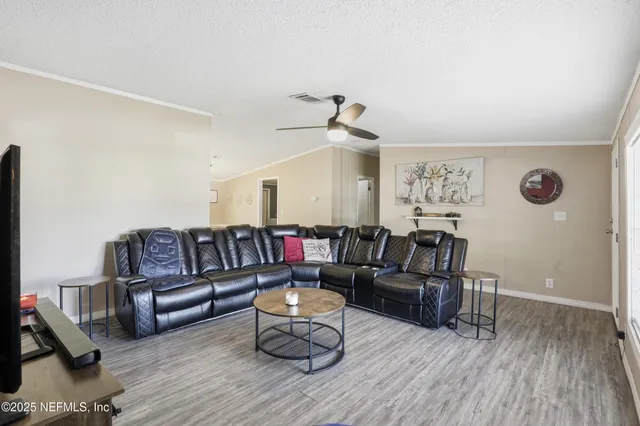 a kitchen that has a sink stainless steel appliances a counter space and a window