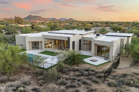 an aerial view of residential houses with outdoor space