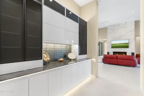 a view of a dining room with furniture and a floor to ceiling window