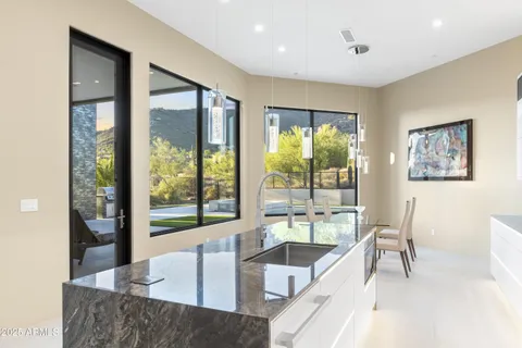 a view of a dining room with furniture window and outside view