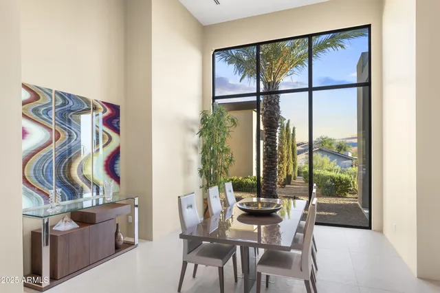 a spacious bathroom with a double vanity sink a mirror and a bathtub
