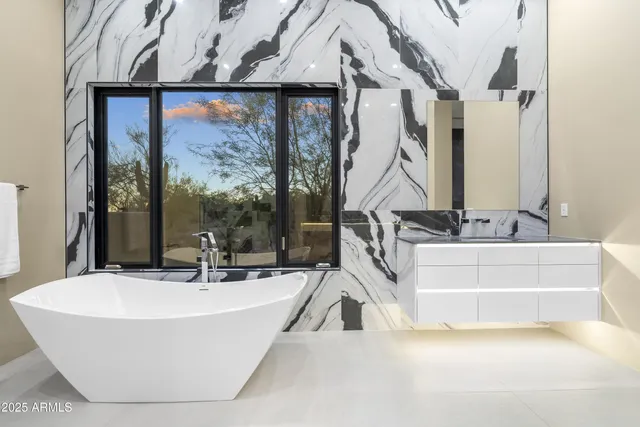 a spacious bathroom with a granite countertop sink