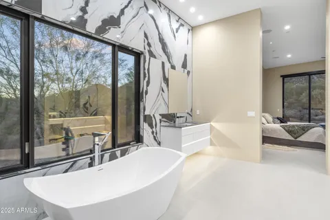 a kitchen with stainless steel appliances granite countertop a sink and a granite counter tops