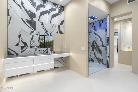 a bathroom with a bathtub and shower