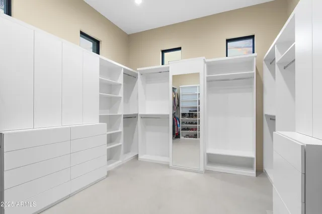 a view of a chairs and table in patio