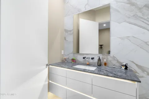 a front view of a house with a yard and mountain view