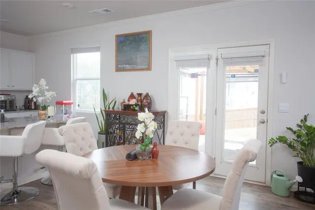 a living room with furniture kitchen and a table