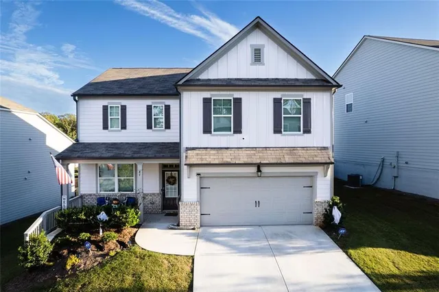 a front view of a house with a yard