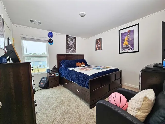 a living room filled with furniture and a large window