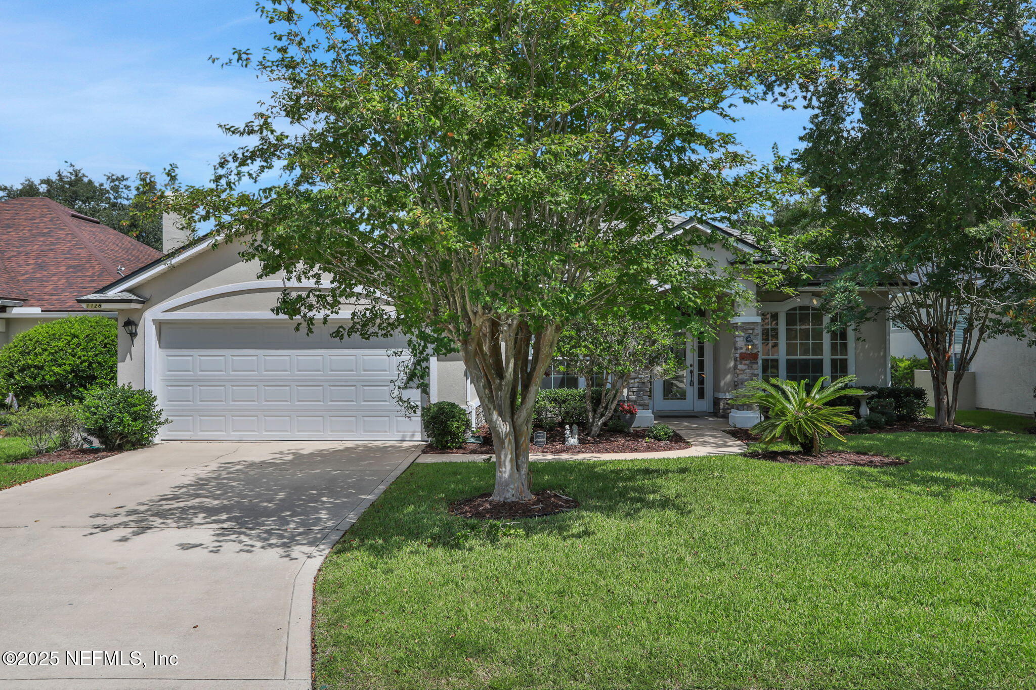 1128 Sandlake Road St. Augustine, FL 32092 - Photo 3 of 39 a view of a house with a yard and tree s