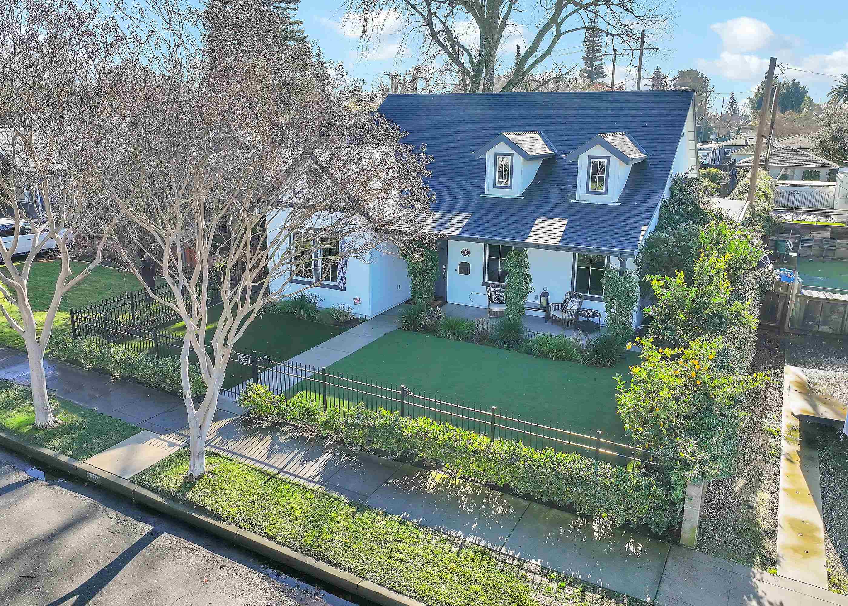 a front view of a house with garden