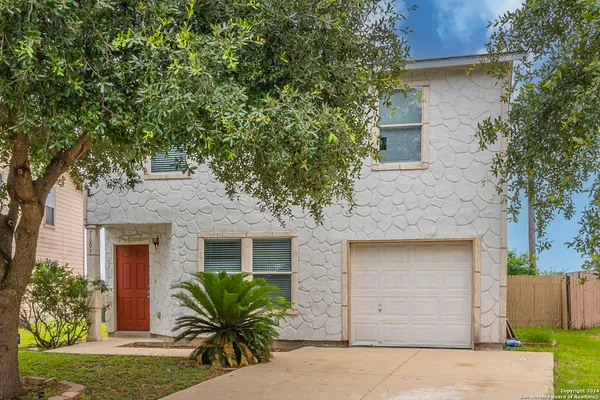 front view of a house with a yard
