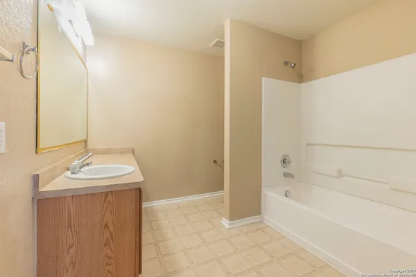 a bathroom with a sink and a bathtub