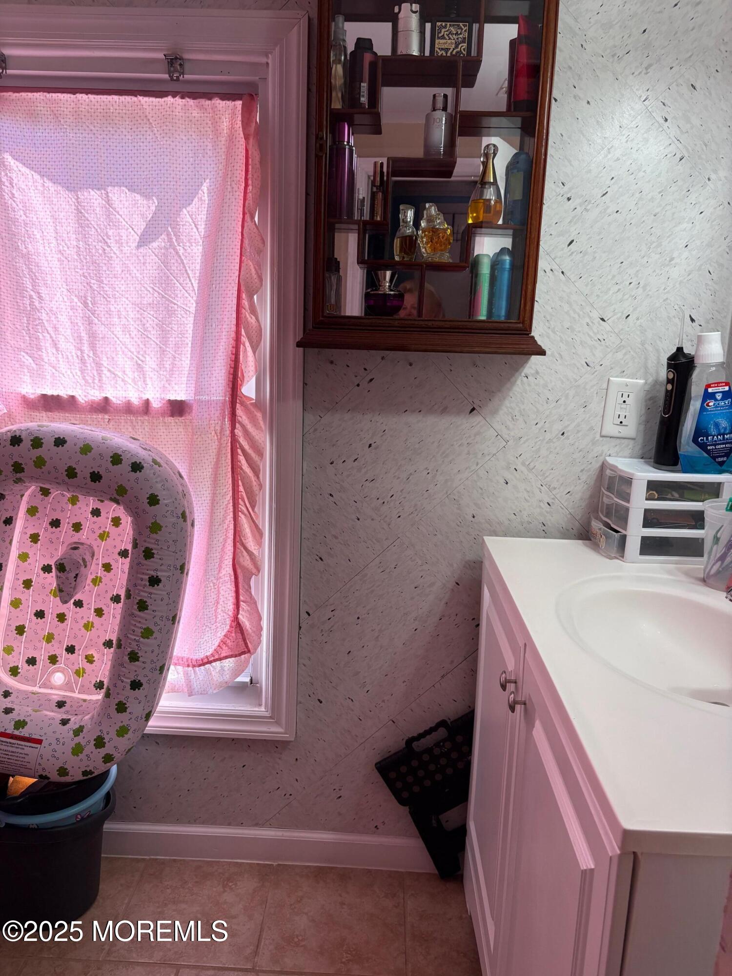 80 Jackson Street Freehold, NJ 07728 - Photo 16 of 21 a bathroom with a sink and a mirror